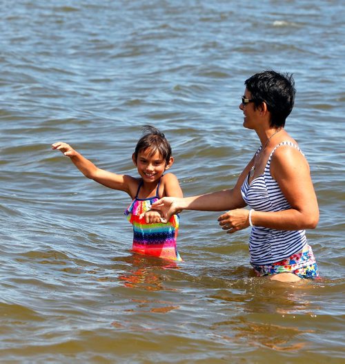 BORIS MINKEVICH / WINNIPEG FREE PRESS
GIMLI, MB - Dana Todd, right, with her daughter Spencer,9, enjoy Lake Winnipeg despite high E.coli levels reported and and beach advisory. July 10, 2017
