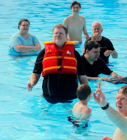 BORIS MINKEVICH / WINNIPEG FREE PRESS
Doug Speirs at Provencher Pool participates in the making of a video to promote drowning prevention week for the Lifesaving Society. Here he wears a bright coloured life jacket. July 10, 2017