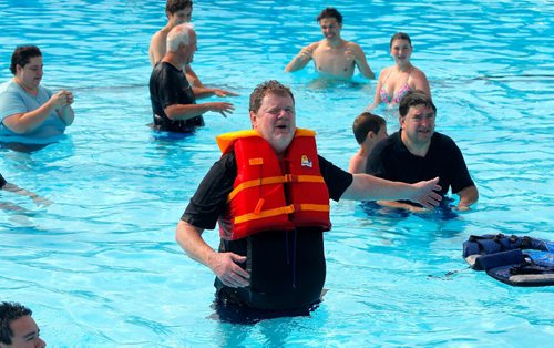 BORIS MINKEVICH / WINNIPEG FREE PRESS
Doug Speirs at Provencher Pool participates in the making of a video to promote drowning prevention week for the Lifesaving Society. Here he wears a bright coloured life jacket. July 10, 2017