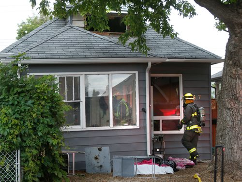 WAYNE GLOWACKI / WINNIPEG FREE PRESS

Winnipeg Fire Fighters at the scene of a early Tuesday morning fire in a home on the 200 block of Martin Ave. West.  A 45-year-old woman died Tuesday in an early morning fire in her Elmwood home that also claimed the lives of her cat and dog. Ashley Prest story  July 11  2017