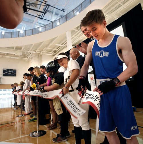 WAYNE GLOWACKI / WINNIPEG FREE PRESS

Manitoba athletes from right Chase Reid-McLean and Mary Martin beside Premier Brian Pallister help do the honours at the Official Grand Opening Ribbon Cutting Ceremonies for the Canada Games Sport for Life Centre Tuesday held in the Qualico Training Centre Gymnasium. Intern  story  July 11  2017
