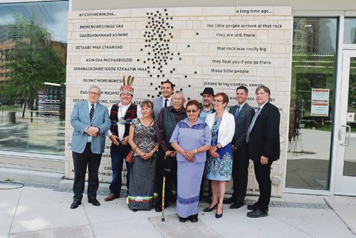 Canstar Community News June 20, 2017 - Lloyd Axworthy, Grand Chief Jerry Daniels with the Southern Chiefs Organization, Olga Houle, Percy Houle, Mary Houle, Annette Trimbee, University of Winnipegs president and vice-chancellor. Back row: Wab Kinew, MLA for Fort Rouge, Eduardo Aquino, artist-architect, Brian Bowman, Winnipegs mayor, and Ian Wishart, minister of education and training at the unveiling of a new wall art at Axworthy Health and RecPlex. (LIGIA BRAIDOTTI/CANSTAR COMMUNITY NEWS/TIMES)