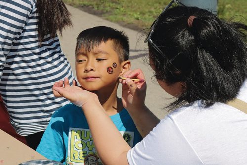 Canstar Community News June 26, 2017 - There was facepainting available for kids at Amber Trails Community School Pride picnic and they were encourage to paint Pride symbols. (LIGIA BRAIDOTTI/CANSTAR COMMUNITY NEWS/TIMES)