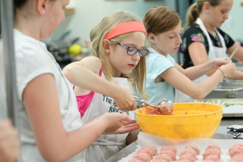 RUTH BONNEVILLE / WINNIPEG FREE PRESS

The Food Studio owner and chef Maria Abiusi teaches kids how to cook during kids cooking camp. For story on the rise of popularity of cooking classes. People want more control over what they eat. 
Michelle Wright scoops out meat to make meat balls.  

July 11, 2017