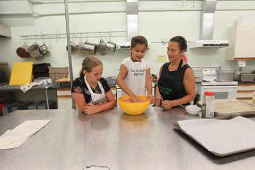RUTH BONNEVILLE / WINNIPEG FREE PRESS

The Food Studio owner and chef Maria Abiusi teaches kids how to cook during kids cooking camp. For story on the rise of popularity of cooking classes. People want more control over what they eat. 
Kids names in picture: Rachel Ruby Hamil (left, blond) and Waenink (right). 
July 11, 2017