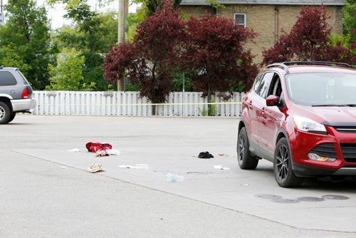 JUSTIN SAMANSKI-LANGILLE / WINNIPEG FREE PRESS
An SUV and some bloody debris are seen outside a gas station at the corner of Maryland and Portage Tuesday evening.
170711 - Tuesday, July 11, 2017.