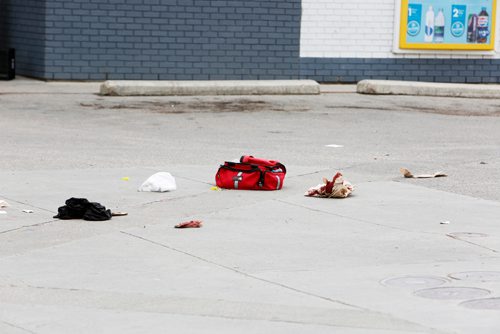 JUSTIN SAMANSKI-LANGILLE / WINNIPEG FREE PRESS
Debris, including blood soaked paper towels and a black shirt are seen next to a red SUV in a gas station parking lot at the corner of Maryland and Portage Tuesday evening.
170711 - Tuesday, July 11, 2017.