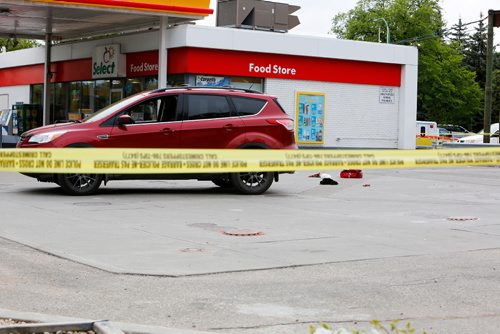 JUSTIN SAMANSKI-LANGILLE / WINNIPEG FREE PRESS
Police tape is seen surrounding an SUV and some bloody debris outside a gas station at the corner of Maryland and Portage Tuesday evening.
170711 - Tuesday, July 11, 2017.