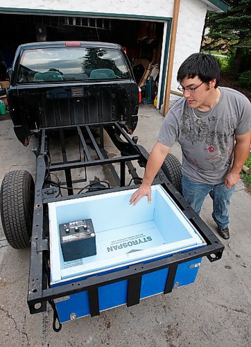 BORIS MINKEVICH / WINNIPEG FREE PRESS  080910 The Sasaki brothers are building an electric truck. Nicholas shows the box where the battery is going.