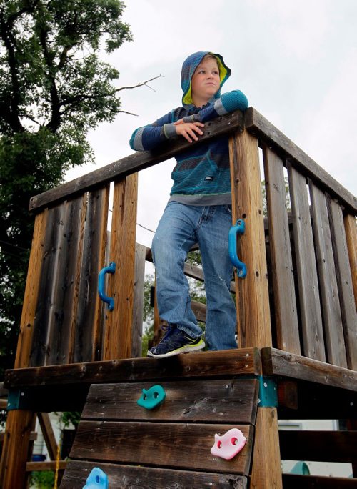 BORIS MINKEVICH / WINNIPEG FREE PRESS
Michael Davis, 9, poses for a photo in the top of the play structure he spotted the truck that was involved with his bike getting stolen in St. James. July 12, 2017