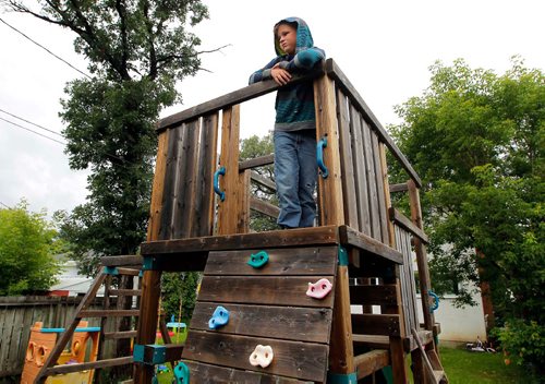 BORIS MINKEVICH / WINNIPEG FREE PRESS
Michael Davis, 9, poses for a photo in the top of the play structure he spotted the truck that was involved with his bike getting stolen in St. James. July 12, 2017