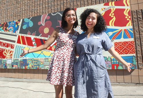 JOE BRYKSA / WINNIPEG FREE PRESS Student artists Brianna Wentz, left, and Annie Beach stand in front of their mural they created called Woven Together. The mural is on the side of the Thrive Thrift Shop at 555 Spence St, it was sponsored by the West End Biz. Annie and Brianna will soon be working on a new mural sponsored by Canada 150- July 13 , 2017 -( Standup photo)