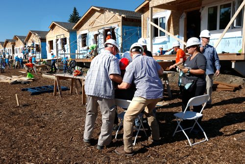 WAYNE GLOWACKI / WINNIPEG FREE PRESS

Security rush in to help former President Jimmy Carter after he sat down to take a  break from building steps for a home on Lyle St. for  the Habitat for Humanitys 34th Jimmy & Rosalynn Carter Work Project. Larry Kusch  Melissa Martin story July 13  2017
