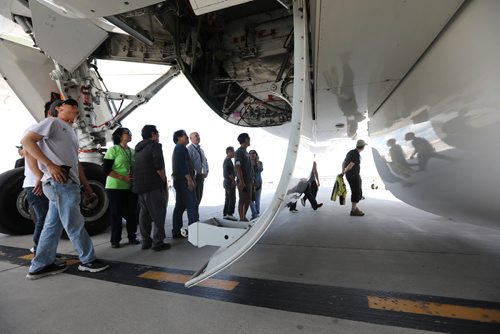 RUTH BONNEVILLE / WINNIPEG FREE PRESS

Boeing employees take a close look at the underbelly and doors that open for the landing gear of  a  Boeing 787 Dreamliner airplane on the tarmac at the airport Thursday.  The employees were bused to the site to see a completed airline with components like the doors that were built by employees at the Winnipeg plant after it made a special landing in Winnipeg.  
See Biz story.  

July 13, 2017