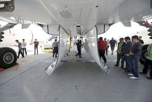 RUTH BONNEVILLE / WINNIPEG FREE PRESS

Boeing employees take a close look at the underbelly and doors that open for the landing gear of  a  Boeing 787 Dreamliner airplane on the tarmac at the airport Thursday.  The employees were bused to the site to see a completed airline with components like the doors that were built by employees at the Winnipeg plant after it made a special landing in Winnipeg.  
See Biz story.  

July 13, 2017