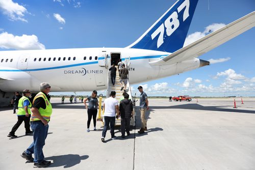 RUTH BONNEVILLE / WINNIPEG FREE PRESS

Boeing employees make their way to take a closer look at a  Boeing 787 Dreamliner airplane on the tarmac at the airport Thursday.  The employees were bused to the site to see a completed airline with components built by them in Winnipeg plant after it made a special landing in Winnipeg.  
See Biz story.  

July 13, 2017