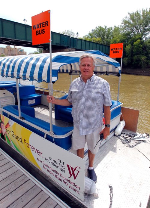 BORIS MINKEVICH / WINNIPEG FREE PRESS
Gord Cartwright, owner-operator, Splash Dash Boat Tours, has actually been able to run his water bus this year for the first time in three years, and says traffic is high. Here he is on one of the water buses at The Forks. KELLY TAYLOR STORY. July 14, 2017