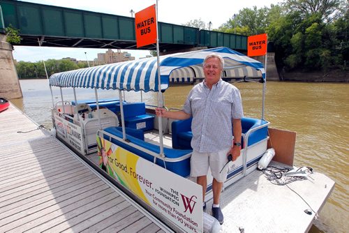 BORIS MINKEVICH / WINNIPEG FREE PRESS
Gord Cartwright, owner-operator, Splash Dash Boat Tours, has actually been able to run his water bus this year for the first time in three years, and says traffic is high. Here he is on one of the water buses at The Forks. KELLY TAYLOR STORY. July 14, 2017