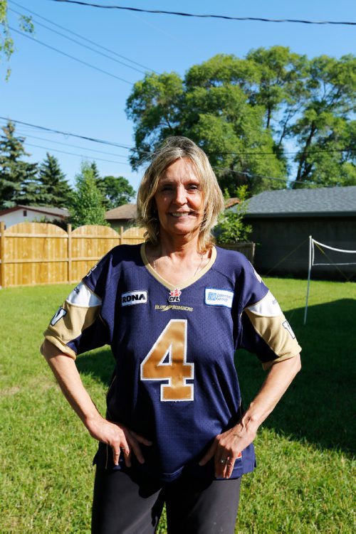 JUSTIN SAMANSKI-LANGILLE / WINNIPEG FREE PRESS
Karen Kuldys poses outside her home Friday. Kuldys was set to win $1 million during last night's Blue Bombers game when a controversial penalty call in the second quarter cost her the prize.
170714 - Friday, July 14, 2017.