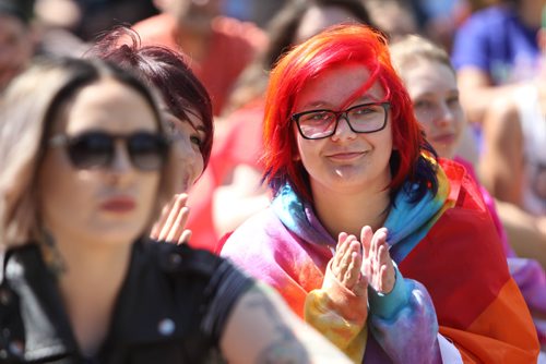 RUTH BONNEVILLE / WINNIPEG FREE PRESS

Julie Gaetz, who spent 8 hours dying her hair the colours of the rainbow, applauds and celebrates with hundreds of others during speeches being made at the 2nd annual Steinbach Pride Parade at K.R. Barkman Park iSaturday.


July 15, 2017