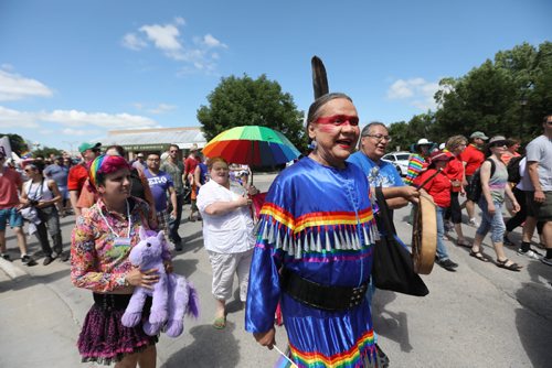 \RUTH BONNEVILLE / WINNIPEG FREE PRESS

Kelly Houle dressed in traditional jingle dress walks with friends in the 2nd annual Steinbach Pride Parade Saturday.


July 15, 2017