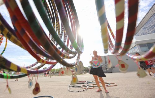 TREVOR HAGAN / WINNIPEG FREE PRESS 
Karen Turnbull of Kazual Art and Soul showing off her hula hoops at the first Manitoba Night Market at the Assiniboia Downs, Sunday, July 16, 2017.