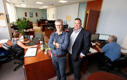 WAYNE GLOWACKI / WINNIPEG FREE PRESS

At left, Royal Unruh, president with  business development manager Trevor Franzmann at A. D. Rutherford International.  To go with a story on how much this customs broker and freight-forwarding company has grown and continues to grow. Martin Cash story ¤July 17   2017