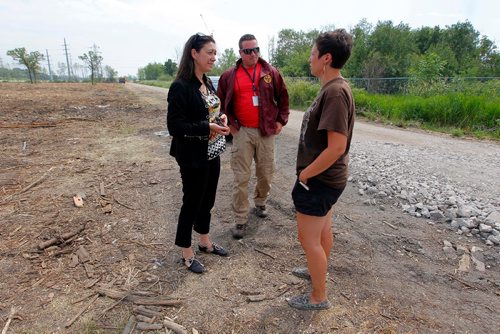 BORIS MINKEVICH / WINNIPEG FREE PRESS
Parker Lands development protestors are camped out on the development site to try to stop it. Police come to talk to protestor Jenna Vandal, right. BEN WALDMAN STORY  July 17, 2017