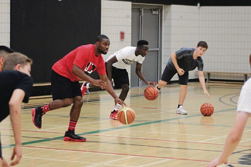 Canstar Community News July 12, 2017 - Jarred Ogungbemi-Jackson (in red) hosts high level basketball camp at the Maples Community Centre. (LIGIA BRAIDOTTI/CANSTAR COMMUNITY NEWS/TIMES)