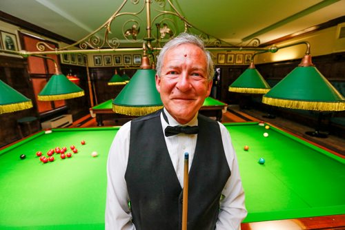 JUSTIN SAMANSKI-LANGILLE / WINNIPEG FREE PRESS
Greg Harder poses Tuesday in front of the billiards tables inside the Manitoba Club's Billiards Lounge. Harder, 61 is a professional player and teacher at the Manitoba Club.
170718 - Tuesday, July 18, 2017.