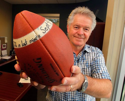 BORIS MINKEVICH / WINNIPEG FREE PRESS
Former Blue Bomber Joe Poplawski posing with an inscribed game ball given to him for his part in a miracle comeback against Ottawa on Sept. 9, 1978.   July 19, 2017