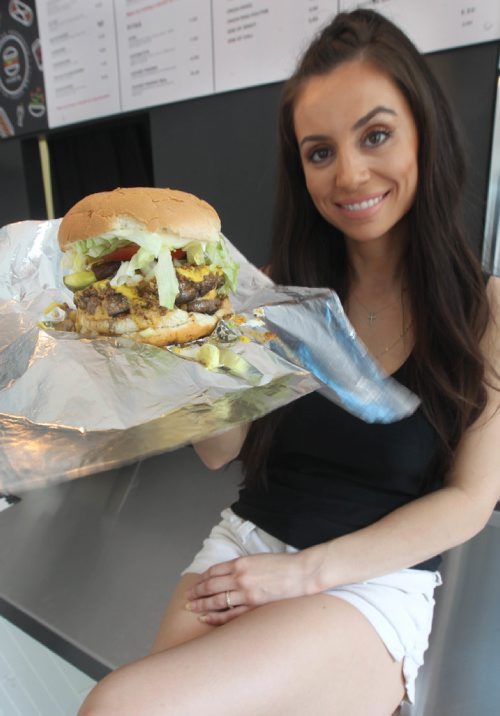 JOE BRYKSA / WINNIPEG FREE PRESS Vicky Ramantanis from Vickys Dinner shows off the Vickys Favorite burger -  July 19 , 2017 -( See  Sanderson story)