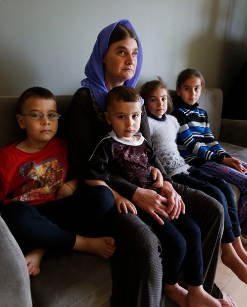 WAYNE GLOWACKI / WINNIPEG FREE PRESS

Nofa Mihlo Rafo with her children from left, Maher, Rebar, Vian and Eman in Winnipeg. The Yazidi refugee family was recently sponsored by the government to begin a new life here was contacted last week by a cousin who spotted one of her two missing sons on social media after he was freed from IS. Ben Waldman story July 19   2017