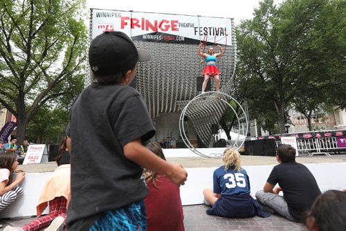 RUTH BONNEVILLE / WINNIPEG FREE PRESS

Street performer from Australia Hannah Cryle performs stunts with her wheel on stage at the Cube in Old Market Square Wednesday afternoon as part of the kickoff to the annual Winnipeg Fringe Festival.  

Standup photo 

July 19, 2017