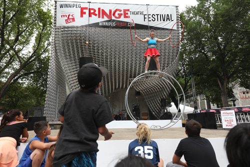 RUTH BONNEVILLE / WINNIPEG FREE PRESS

Street performer from Australia Hannah Cryle performs stunts with her wheel on stage at the Cube in Old Market Square Wednesday afternoon as part of the kickoff to the annual Winnipeg Fringe Festival.  

Standup photo 

July 19, 2017