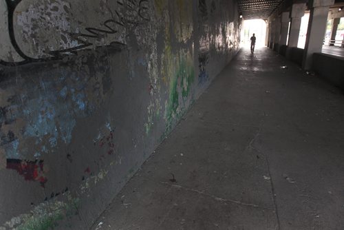 JOE BRYKSA / WINNIPEG FREE PRESSTwo dozen volunteers painted the dark underpass on the west side- near Main St and Higgins Ave white to brighten it up- Here is the east side with its current dark paint. Volunteers have plans to paint it white as well next week.  -  July 20 , 2017 -( Standup Photo)
