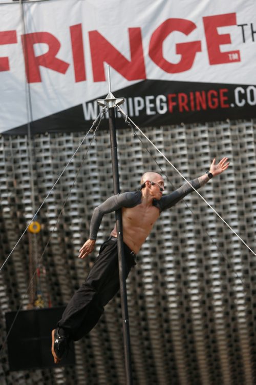 WAYNE GLOWACKI / WINNIPEG FREE PRESS

Reuben Dot Dot Dot from Melbourne, Australia performs on a 17 foot Chinese pole part of the Winnipeg Fringe Festival entertainment at Market Square in Winnipeg's Exchange District on Thursday.¤The Fringe Festival continues until July 30.       July 20   2017