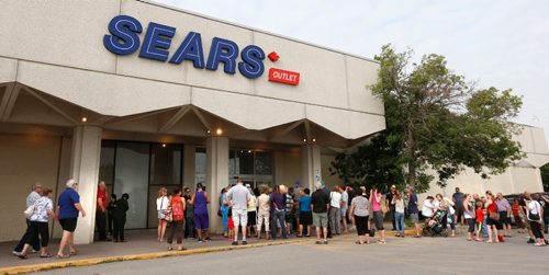 WAYNE GLOWACKI / WINNIPEG FREE PRESS

 Shoppers wait for the doors to open Friday morning to check out the sales at the Sears Outlet Store at Garden City Shopping Centre. Sears Canada announced last month 59 of its 127 retail outlets in Canada, including its outlet store in Garden City, will be closing.    July 21   2017