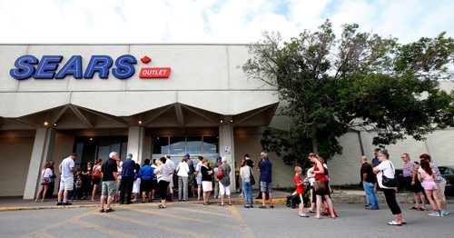 WAYNE GLOWACKI / WINNIPEG FREE PRESS

 Shoppers wait for the doors to open Friday morning to check out the sales at the Sears Outlet Store at Garden City Shopping Centre. Sears Canada announced last month 59 of its 127 retail outlets in Canada, including its outlet store in Garden City, will be closing.    July 21   2017