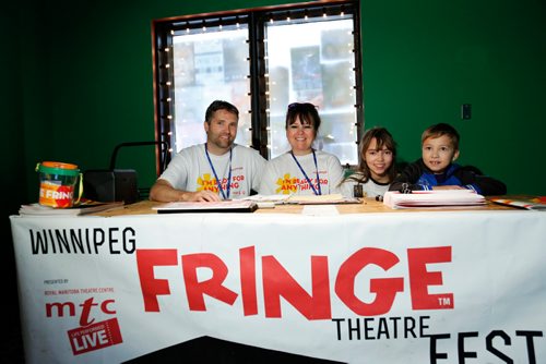 JUSTIN SAMANSKI-LANGILLE / WINNIPEG FREE PRESS
Veteran Fringe Fest volunteers Patrick and Kathleen Armstrong pose with their kids Sadie and Beckett inside the Tom Hendry Warehouse Theatre Friday. The couple have been volunteering at the festival since 2006.
170721 - Friday, July 21, 2017.