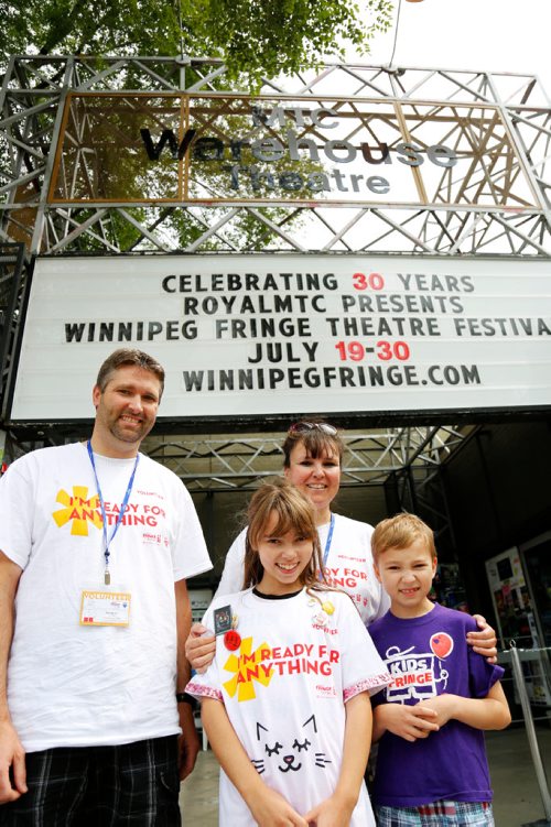 JUSTIN SAMANSKI-LANGILLE / WINNIPEG FREE PRESS
Veteran Fringe Fest volunteers Patrick and Kathleen Armstrong pose with their kids Sadie and Beckett outside the Tom Hendry Warehouse Theatre Friday. The couple have been volunteering at the festival since 2006.
170721 - Friday, July 21, 2017.