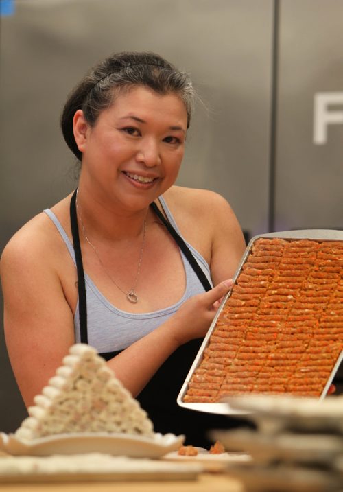 RUTH BONNEVILLE / WINNIPEG FREE PRESS

49.8 INTERSECTION - Springroll Queen piece on Roweliza Lulu - the Springroll Queen.  A year ago, Roweliza started marketing springrolls; in addition to pork and shrimp, she has a bunch of left-of-center flavours, too, including blueberry cheesecake, apple pie, bacon and jalopeno.  Lulu makes her rolls with her mom and two others in the Knox United Church Kitchen but will be moving to her own store next month.  
Luu holds tray of Traditional Filipino pork filling with finished rolls in front of her.  

See Dave Sanderson story.  


July 20, 2017