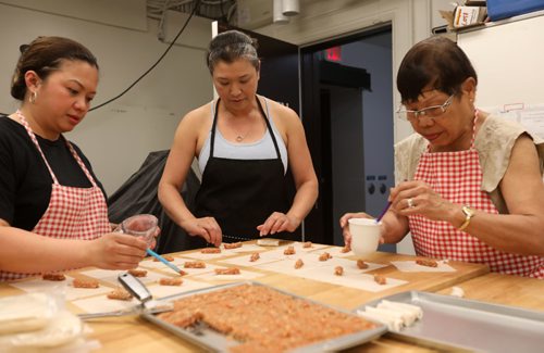 RUTH BONNEVILLE / WINNIPEG FREE PRESS

49.8 INTERSECTION - Springroll Queen piece on Roweliza Lulu - the Springroll Queen.  A year ago, Roweliza started marketing springrolls; in addition to pork and shrimp, she has a bunch of left-of-center flavours, too, including blueberry cheesecake, apple pie, bacon and jalopeno.  Lulu makes her rolls with her mom and two others in the Knox United Church Kitchen but will be moving to her own store next month.  
Names -  Heidee Bautista (left), Roweliza Lulu and Lulu's mom Norma Lulu 


See Dave Sanderson story.  


July 20, 2017