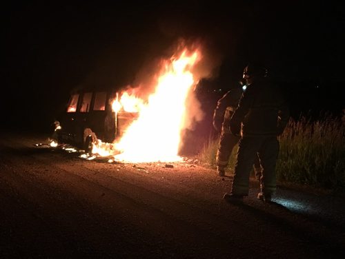 JUSTIN SAMANSKI-LANGILLE / WINNIPEG FREE PRESS
Firefighters inspect the burning remains of a vehicle late Saturday night. The vehicle was found on the side of Mallard Road between Klimpke and Sturgeon.
170722 - Saturday, July 22, 2017.