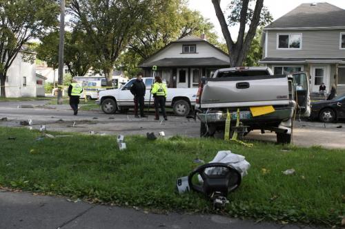 Ruth Bonneville Winnipeg Free Press Local, Police officers collect evidence from the scene of a collision between a GMC Sierra Pick-up truck and a Fire truck on Redwood street at Andrews which took place around 3:45 am. Ruth Bonneville Winnipeg Free Press