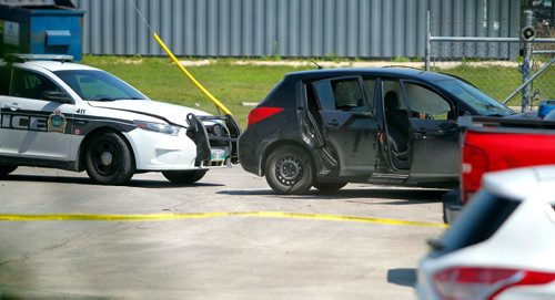 BORIS MINKEVICH / WINNIPEG FREE PRESS
Police shooting scene on Archibald between Messier Street and Kavanagh Street. This photo is of the small black car that was rammed by police from behind that ended up in the Roofmart parking lot. July 24, 2017