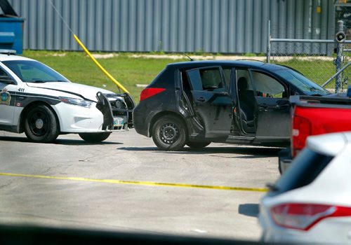 BORIS MINKEVICH / WINNIPEG FREE PRESS
Police shooting scene on Archibald between Messier Street and Kavanagh Street. This photo is of the small black car that was rammed by police from behind that ended up in the Roofmart parking lot. July 24, 2017