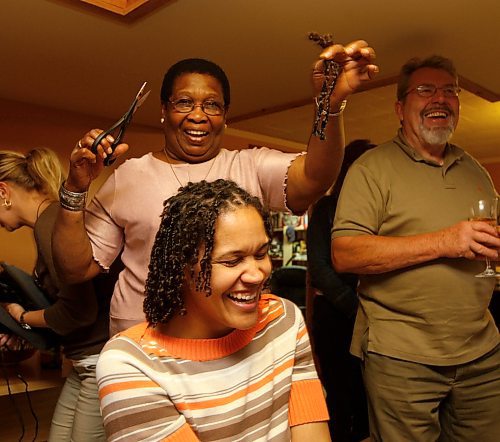 BORIS MINKEVICH / WINNIPEG FREE PRESS 080914 Christina Hazzard gets one of her 105 braids clipped off in the name of Cancer Care. She planned on raising $10 a braid= $1050. Her grandmother Sheila is with the clips in this photo. SEE EMAIL FOR MORE DETAILS.
