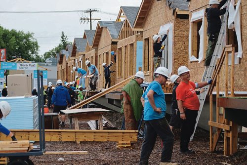 Canstar Community News July 12, 2017 - Volunteers help build houses for Habitat for Humanitys project in Winnipeg. (LIGIA BRAIDOTTI/CANSTAR COMMUNITY NEWS/TIMES)