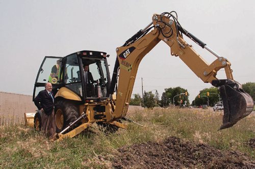 Canstar Community News July 20, 2017 - Coun. Russ Wyatt (Transcona) looks on as mayor Brian Bowman breaks ground on the twinning of Transcona Boulevard, a joint venture between the City of Winnipeg and developer EdgeCorp. The project is expected to be completed by October. (SHELDON BIRNIE/CANSTAR/THE HERALD)